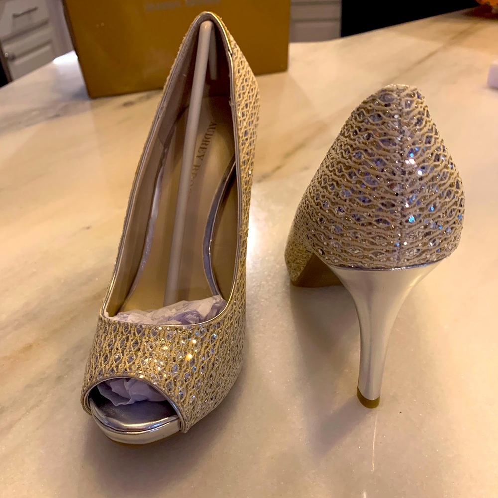 Silver Audrey Brooke silver open toed heels.